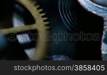 Close up on rotating cogs of a stopwatch