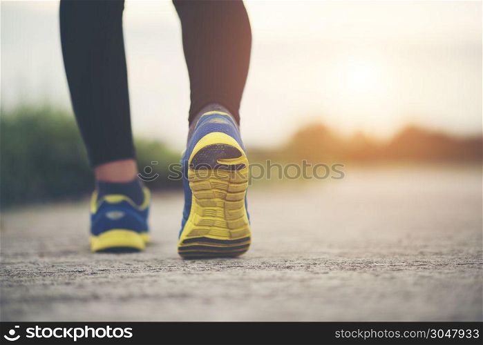Close up on running shoes Fitness women training and jogging
