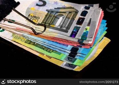 Close up on stack of EURO money. Euro banknotes isolated.