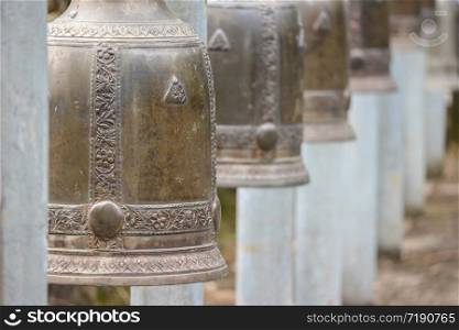 close up on Thai traditional metal bell at temple.