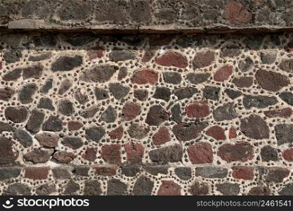 Close up on the stone wall of the aztec pyramid, ancient city of Teotihuacan, Mexico