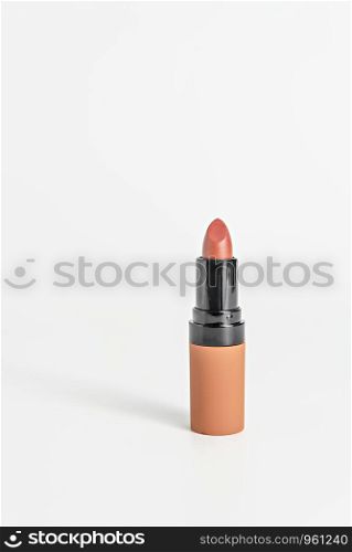 close up orange color lipstick on white background. Set of colorful lipsticks