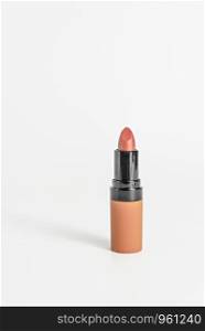 close up orange color lipstick on white background. Set of colorful lipsticks