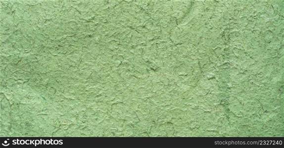 Close up panorama crumpled craft paper green texture and background with copy space
