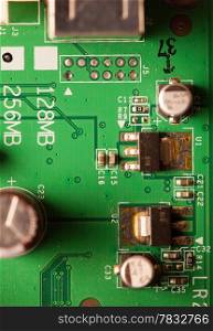 Close-up part of modern equipment. Green electronic circuit as technology concept.