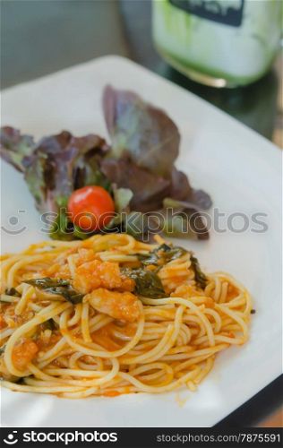 close up pasta with tomato sauce , shrimp and vegetable