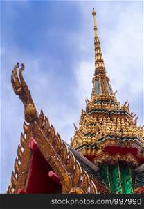 Close up Pavilion of Wat Hua Lamphong roof with blue sky and clouds