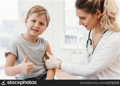 close up pediatrician vaccinating kid