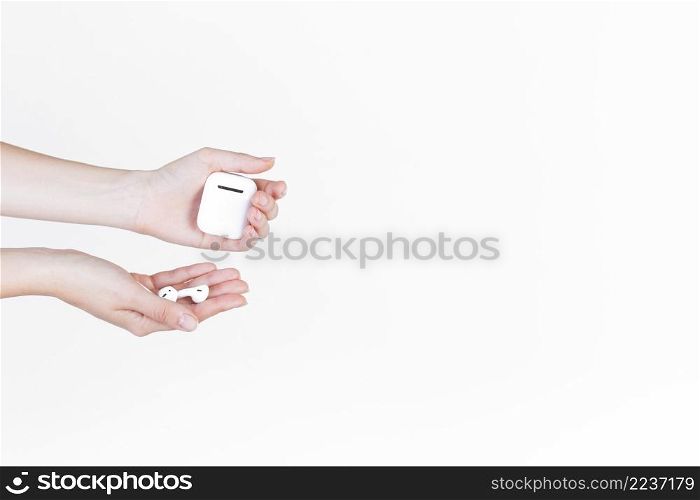 close up person s hand holding hearing aid battery