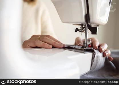 close up person using sewing machine. Resolution and high quality beautiful photo. close up person using sewing machine. High quality beautiful photo concept