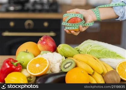 close up person with fruits arrangement