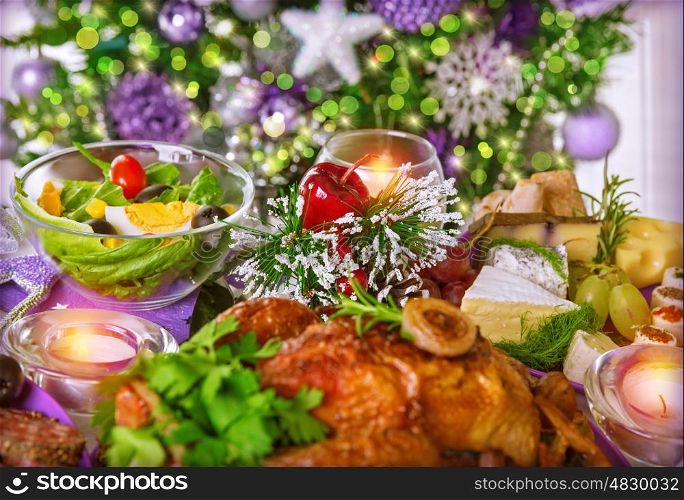 Close up photo of festive table setting, traditional Christmastime dinner with backed chicken on centerpiece of table, New Year eve concept