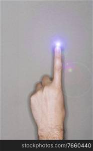 Close up photo of man finger with lens flare 