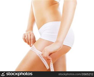 close-up photo of sporty woman shapes with measure on white background