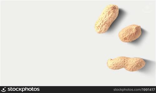 Close up photo of top view peanuts, raw peanuts in the nutshells isolated on grey background.