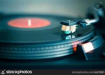 Close up picture of a record player, playing a record