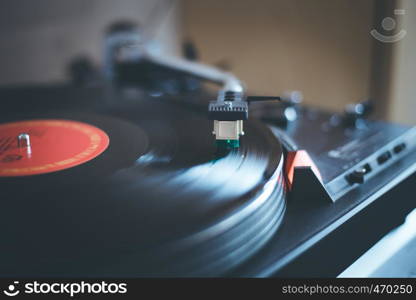 Close up picture of a record player, playing a record