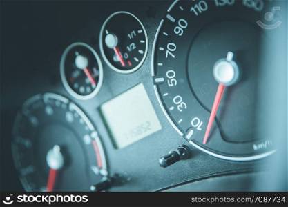 Close up picture of car dashboard with instruments and tachometer