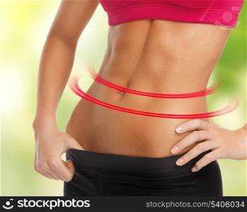 close up picture of woman with trained abs