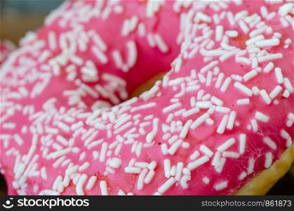 Close up pink donut, selective focus.