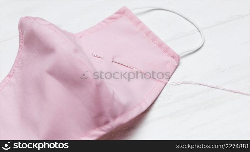 close up pink fabric mask