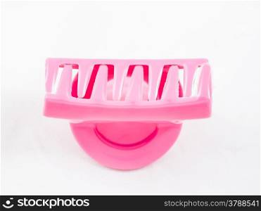 Close up pink hairpin isolated on white background