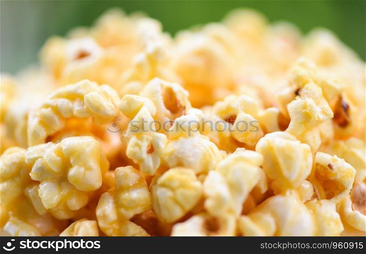 Close up popcorn in cup and nature green backgroubd / Sweet butter popcorn salt