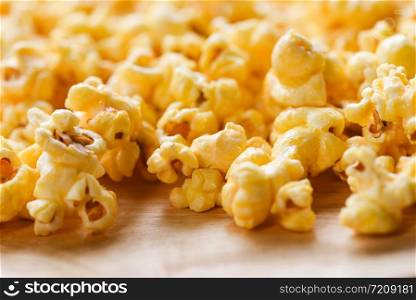 Close up popcorn / Sweet butter popcorn salt on wooden backgroubd