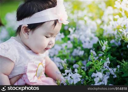 Close up portrait Asian cute baby girl with Natural light background