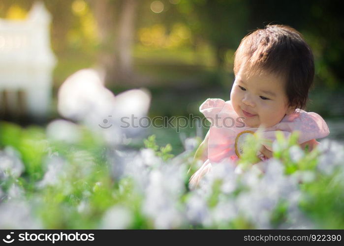 Close up portrait Asian cute baby girl with Natural light background