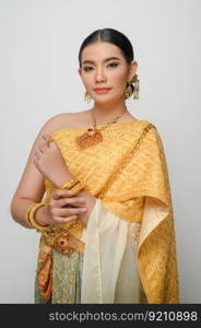 Close up, Portrait beautiful Asian woman in traditional Thai dress costume smile and pose gracefully on white background