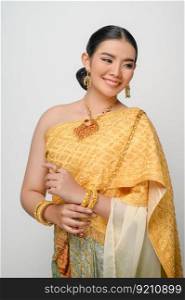 Close up, Portrait beautiful Asian woman in traditional Thai dress costume smile and pose gracefully on white background