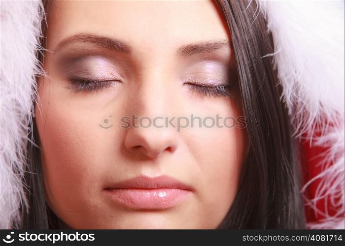 Close up portrait beautiful woman wearing santa claus costume clothes daydreaming with closed eyes