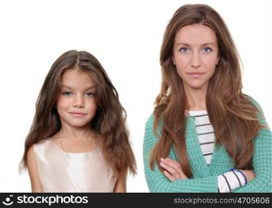 Close up portrait of a beautiful little girl and happy mother, isolated on white background