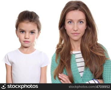 Close up portrait of a beautiful little girl and happy mother, isolated on white background