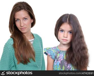 Close up portrait of a beautiful little girl and happy mother, isolated on white background