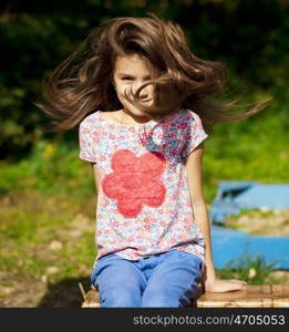 Close up portrait of a beautiful nine year old little girl in autumn park