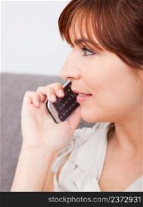 Close-up portrait of a beautiful woman talking on phone