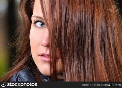 close up portrait of a beautiful young brown haired woman
