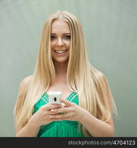 Close up portrait of a beautiful young girl talking on his cell phone in a shopping center