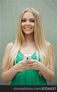 Close up portrait of a beautiful young girl talking on his cell phone in a shopping center