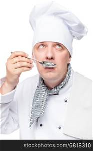 close-up portrait of a chef with a metal spoon on a white background
