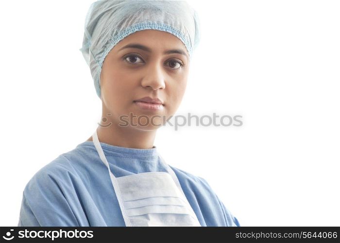Close-up portrait of a confident female surgeon isolated over white background