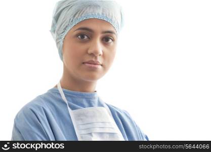 Close-up portrait of a confident female surgeon isolated over white background