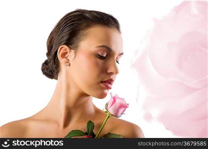 close up portrait of a cute girl brunette looking a pink rose