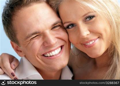 Close-up portrait of a cute young loving couple embracing