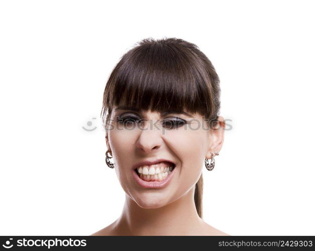 Close-up portrait of a funny woman with a disappointed expression, isolated on white background