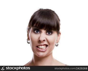 Close-up portrait of a funny woman with a mad expression, isolated on white background