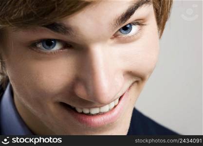 Close-up portrait of a handsome man smiling