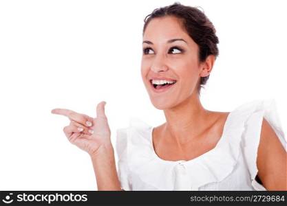Close up portrait of a happy young woman pointing up at copyspace on a isolated white background